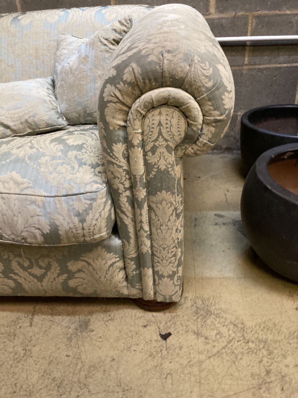 An early 20th century upholstered Chesterfield settee, length 200cm, depth 110cm, height 70cm